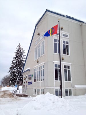 A Sámi flag flies outside Finlandia University in Hancock, Michigan, in celebration of Sámi National Day.