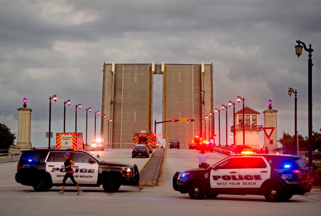 The Royal Park Bridge was closed to all traffic Sunday afternoon as police and fire-rescue personnel respond after a cyclist fell and died, striking a lower portion of the structure Feb. 6 in West Palm Beach, Fla.
