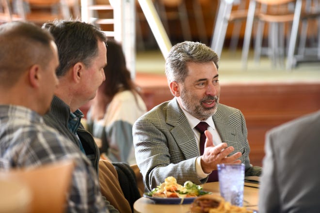 Gregory Miller, who will become Malone University's 14th president on July 1, meets with local religious leaders Monday during lunch at Brehme Centennial Center on Malone's campus.