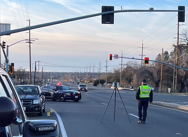Redding police investigate a collision between a car and a pedestrian on Highway 273 at the intersection of South Bonnyview Road on Saturday Feb. 5, 2022.