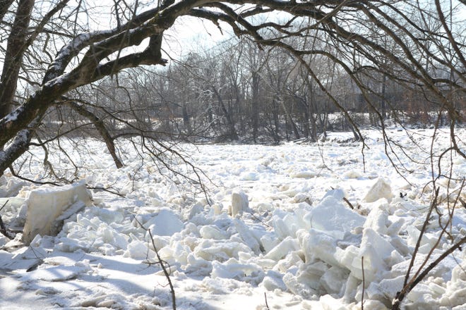 Chunks of ice clog the Muskingum River adjacent to Riverside Park in Zanesville on Monday. Officials worry the ice could cause additional flooding.