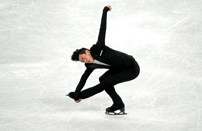 Nathan Chen skated in the men's short program of the team competition on Friday as the U.S. won the silver medal in the figure skating event.