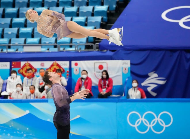 Alexa Knierim and Brandon Frazier perform in the pairs free program of the figure skating mixed team final during the Beijing Olympics at Capital Indoor Stadium.
