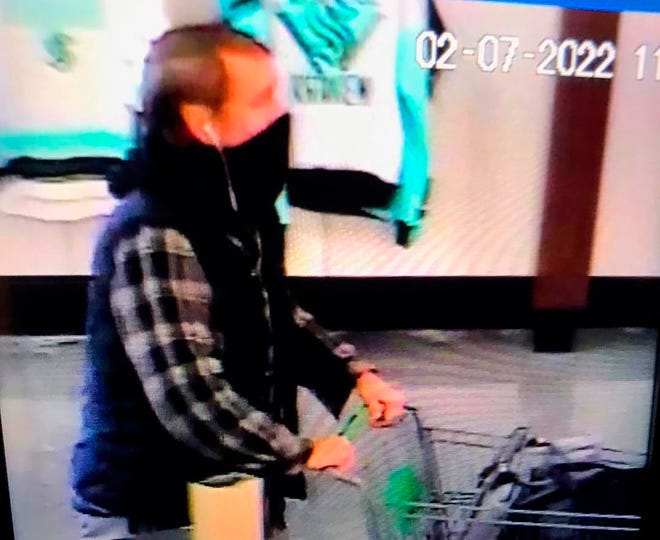 This image from security camera video provided by police in Richland, Wash., shows a suspect opening fire at a Fred Meyer store in Richland on Monday, February 7, 2022. Police say one person was killed and another injured Monday morning in a shooting at the store.  Police said the suspect is believed to have fled the store after the shooting.