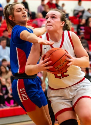 Moon's Reilly Sunday drives for the basket against Chartiers Valley during their game Monday at Moon Area High School.[Lucy Schaly/For BCT]