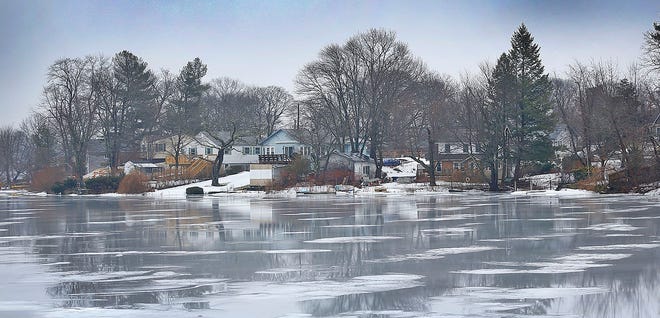 Ice melts on Whitmans Pond in Weymouth in February.