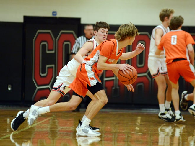 Colton Conkle, left, guards Meadowbrook's Easton Eibel during Coshocton's 55-38 loss to visiting Colts during action last year. Eibel will be one of just two lettermen back this season from Meadowbrook's regional qualifying team from last season.