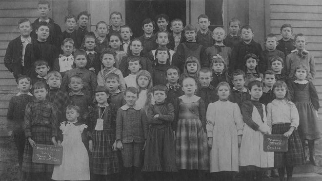 Students at Maiden Lane School in 1891. Seventy-five years ago, an item in the Chronicle-Express noted the Maiden Lane parking station was once the site of the school.