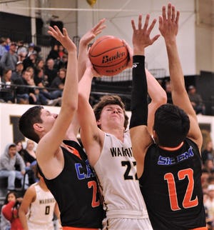 Abilene High's Jack Breckenridge, center, shoots as San Angelo Central's Kollin Allbright, left, and Dominic Ruiz (12) defend in the first half.