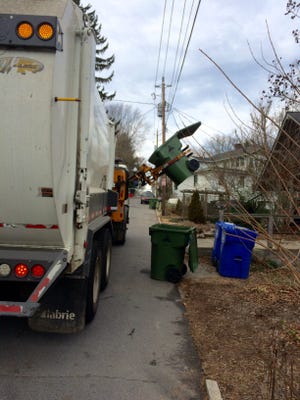 The city of Asheville says about 30 trash bins a year are lost because they accidentally fall into the trash truck's hopper. Getting them out can be dangerous and time-consuming, the city says.