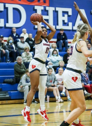 Sacred Heart's ZaKiyah Johnson tries for three points in the first half against visiting Notre Dame Tuesday night. Feb. 8, 2022