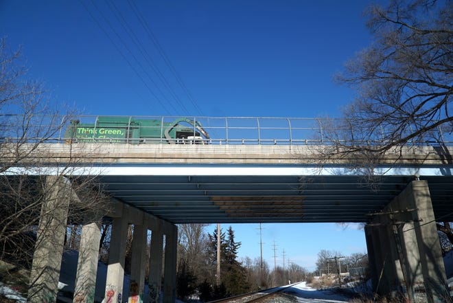     The Eight Mile bridge over the CSX train tracks just east of Novi Road. Boards have been positioned under the bridge (and can be seen in this photo) to prevent pieces of concrete from falling on the tracks.                           