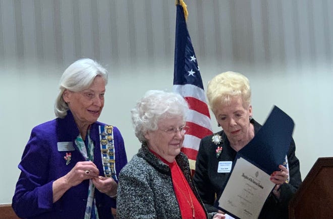 At the 87th Birthday meeting of the Piety Hill Chapter of the Daughters of the American Revolution, an award was presented for outstanding community service to Diane K. Bert (center). Barbara Suhay (left) is in charge of the chapter’s community service award. She presented the lapel pin to Diane who also received the certificate from Grace Bliss Smith (right), Michigan DAR Community Service chairman.
