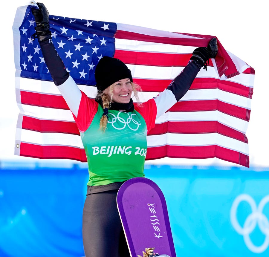 Lindsey Jacobellis celebrates winning the gold medal in the women's snowboard cross.