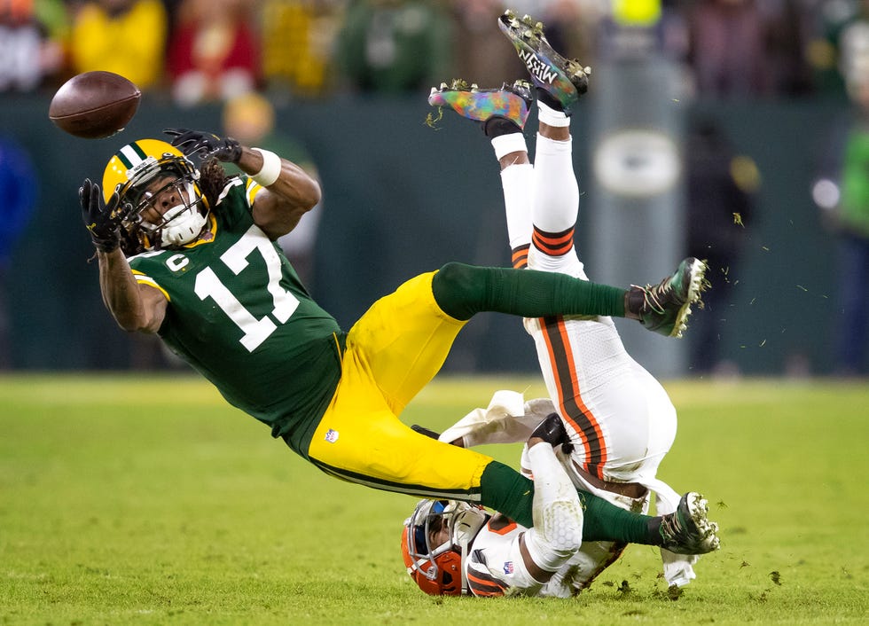 Green Bay Packers wide receiver Davante Adams attempts to catch a pass against Cleveland Browns cornerback Denzel Ward in the fourth quarter on December 25, 2021, at Lambeau Field in Green Bay, Wis.
