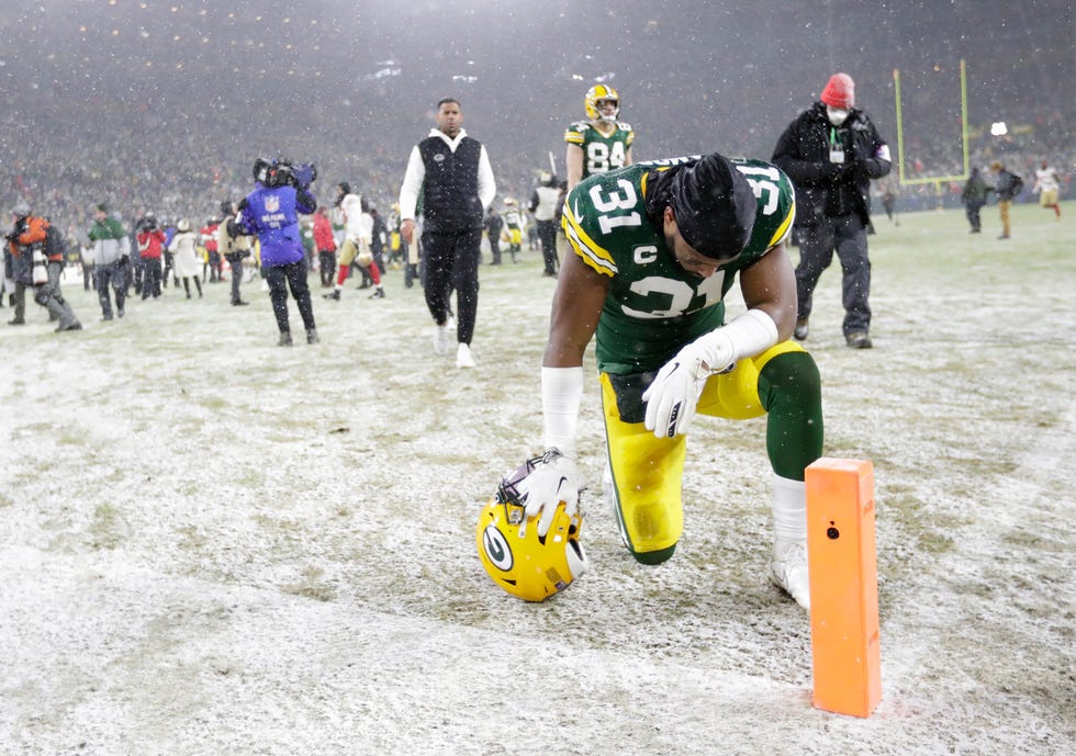 Green Bay Packers safety Adrian Amos takes a knee in the end zone after a 13-10 loss against the San Francisco 49ers during their NFL divisional round football playoff game on January 22, 2022.