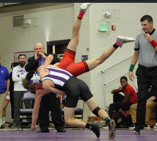 Bloomington South's Evan Roudebush upends his opponent during the IHSAA regional final on Saturday, Feb. , 2022.