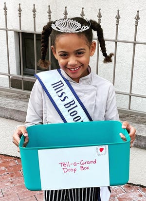 Anurika Enyiaku's Tell-A-Grand project is part of her service work as the National American Miss Bloomington 2021-2022﻿. Here she shows one of her drop boxes in a photo from her Facebook fan page.