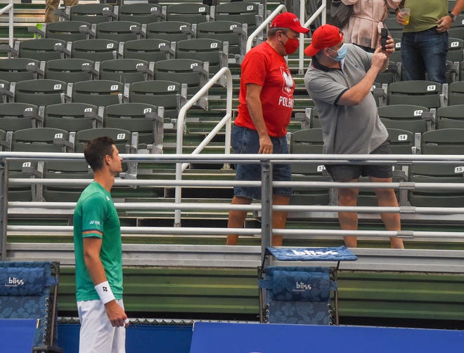 Hubert Hurkacz poses for photos with fans following his 6-3, 6-3 victory against Sebastian Korda in the finals of the Delray Beach Open last January.