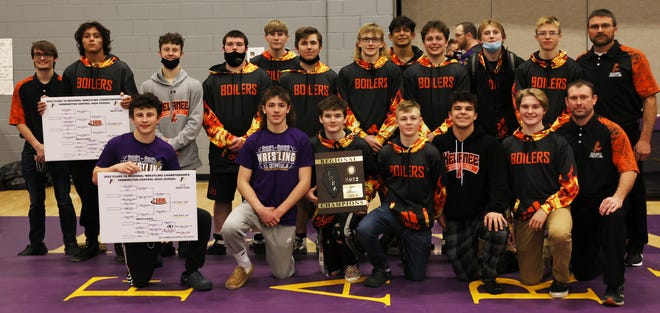 Kewanee High School's wrestling team shows off their regional championship hardware. Several team members will compete in sectionals this weekend.