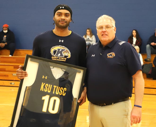 Arthur Jackson—the Golden Eagles lone senior---was honored by Coach Tharp before the game.