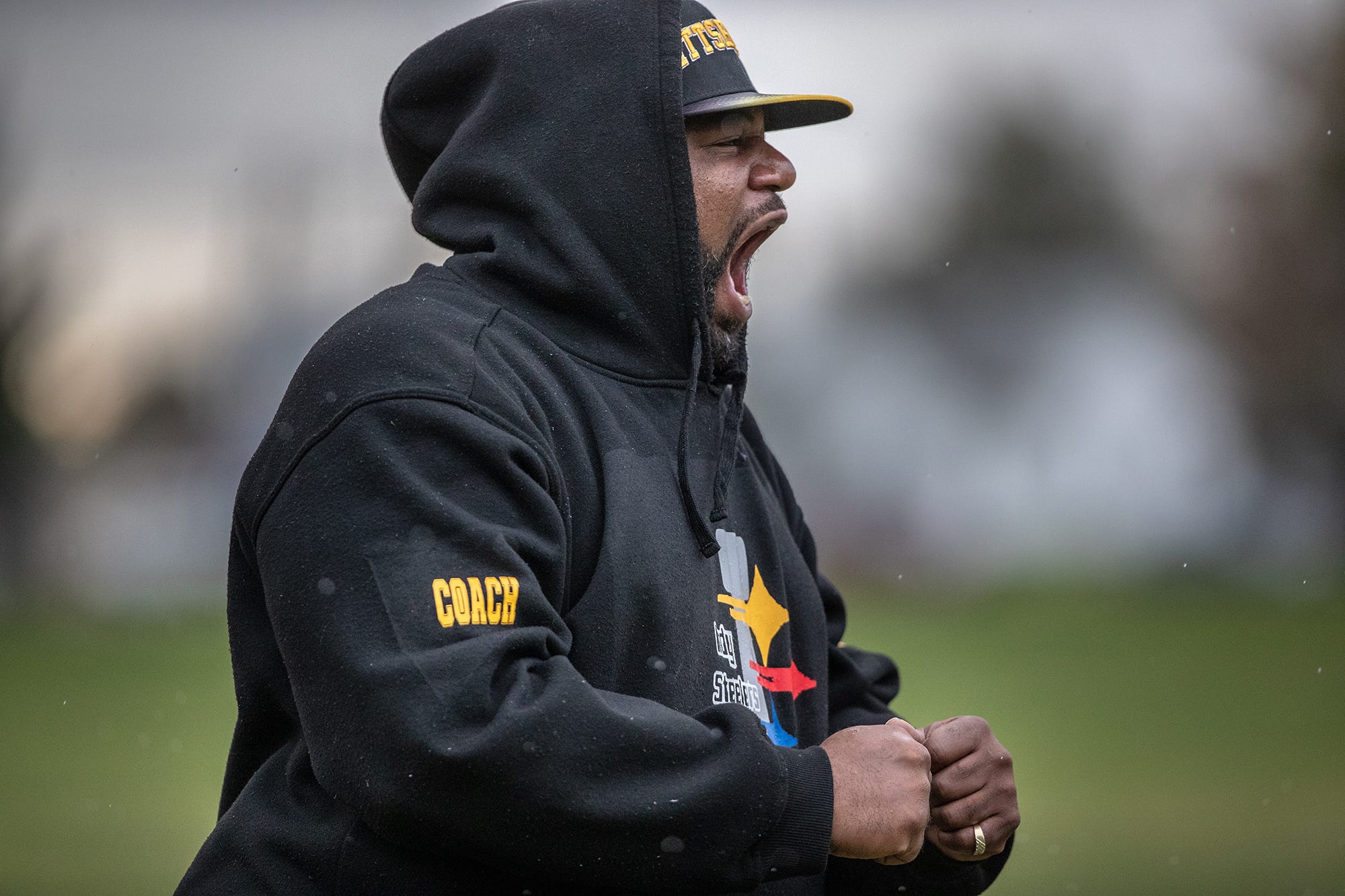 Indy Steelers coach Donnell Hamilton yells after a long run play by a player on the 8u team during their league championship against the City Colts on Saturday, Oct. 28, 2018. The Steelers would lose in overtime 12-6. 