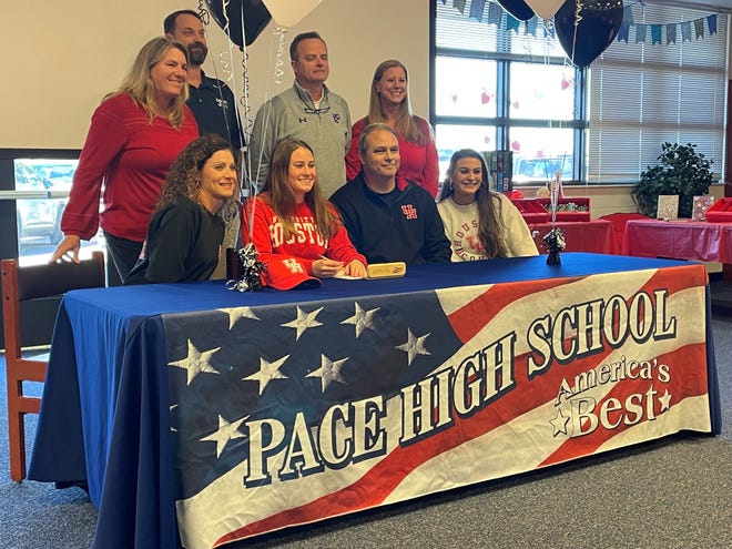 Pace senior Landry Hadder (bottom row, second to the left) signed her letter of intent to swim for the University of Houston on Wednesday, Feb. 9, 2022 from Pace High School.