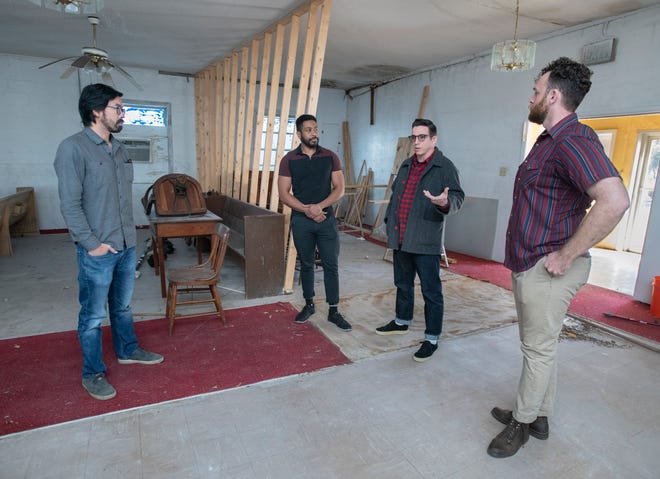 From left, developers Jordan Yee, Jamal Warren, Alistair McKenzie, and John David Ellis talk about their plans to convert the old Mt. Lily Baptist Church building at 209 North A Street into affordable studio apartments in downtown Pensacola on Thursday, Feb. 10, 2022.