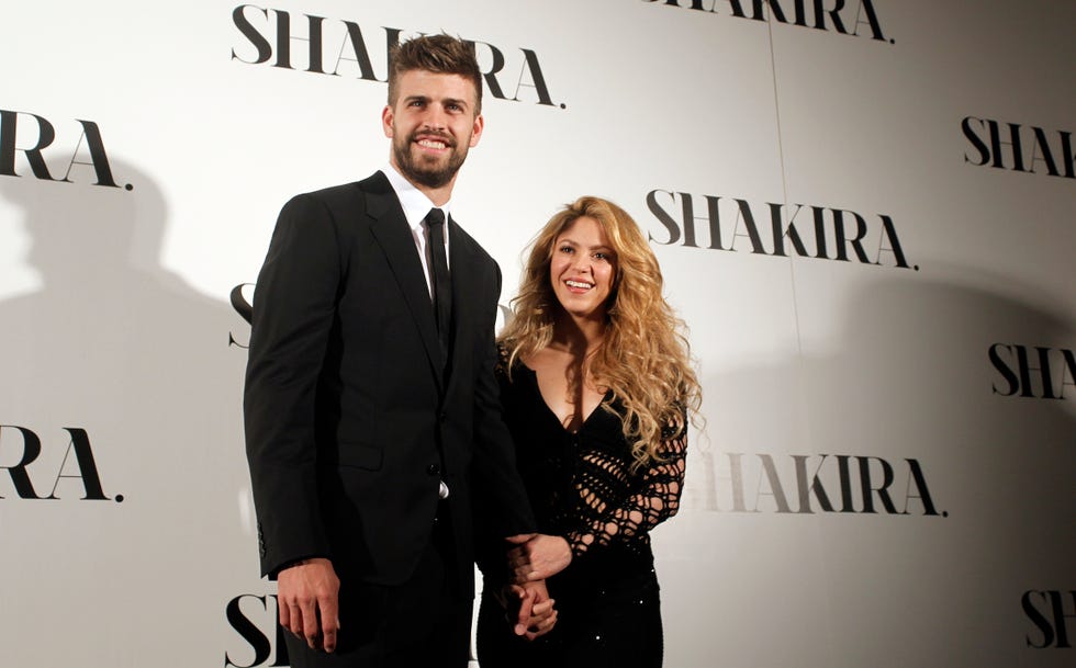 Colombian singer Shakira, right, and FC Barcelona's soccer player Gerard Pique pose to the media during the presentation of her new album "Shakira" in Barcelona, Spain, Thursday, March 20, 2014.