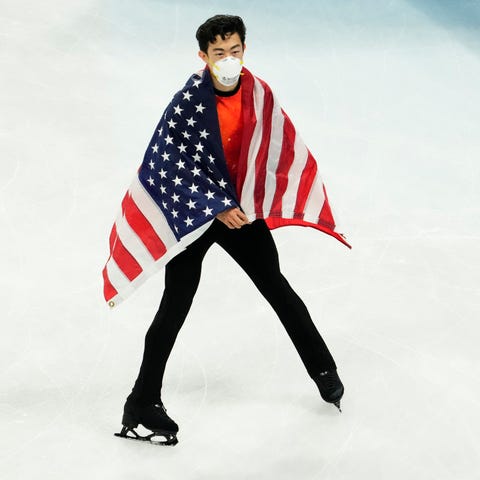 Nathan Chen celebrates after winning the gold meda