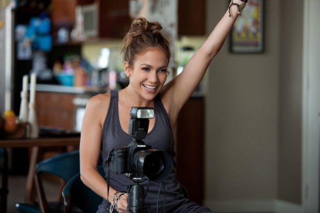 Holly (Jennifer Lopez) snaps a baby portrait in “What to Expect When You’re Expecting.”