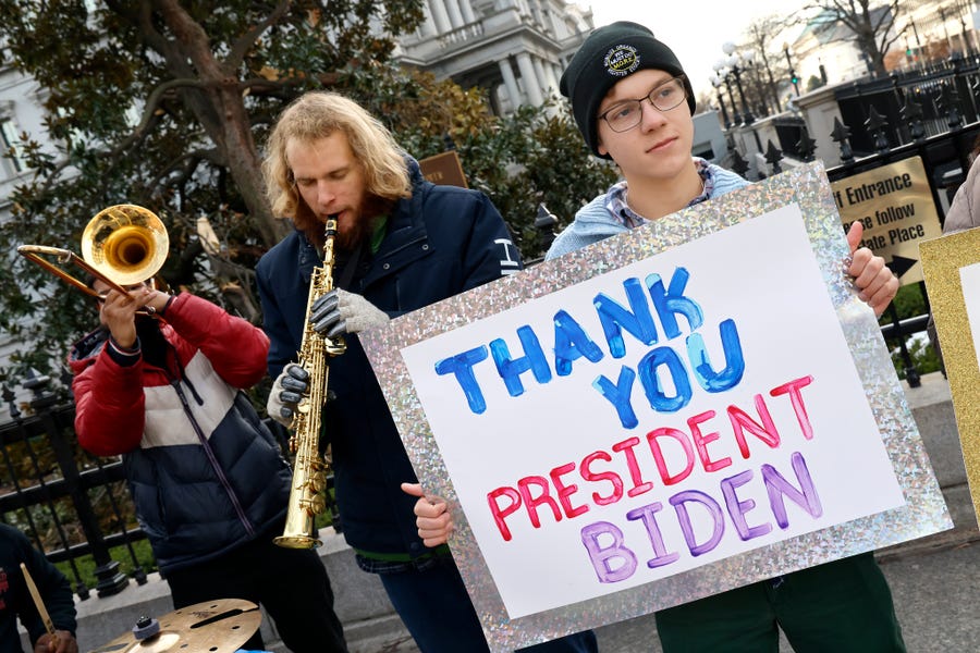 Student loan borrowers and the Too Much Talent Band thank President Joe Biden and Vice President Kamala Harris for extending the student loan pause and now demand that they cancel student debt at a gathering outside The White House on Jan. 13, 2022 in Washington, D.C.