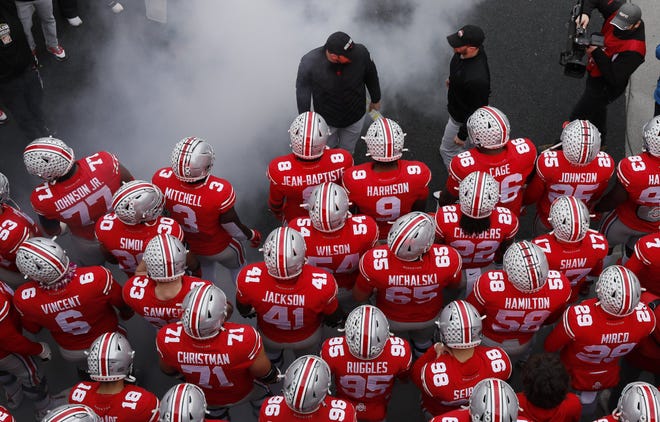 Ohio State Buckeyes head coach Ryan Day leads his team onto the field prior to the NCAA football game against the Michigan State Spartans at Ohio Stadium in Columbus on Saturday, Nov. 20, 2021. 