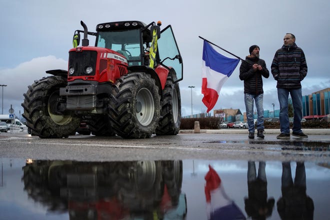 Protesters prepare to leave for a convoy in Lyon, central France on Feb.11, 2022. Authorities in France and Belgium have banned road blockades threatened by groups organizing online against COVID-19 restrictions. The events are in part inspired by protesters in Canada. Citing 