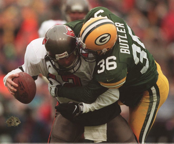 Green Bay Packers safety LeRoy Butler sacks Tampa Bay quarterback Trent Dilfer during the second quarter of their game Sunday, January 4, 1998 at Lambeau Field in Green Bay, Wis.