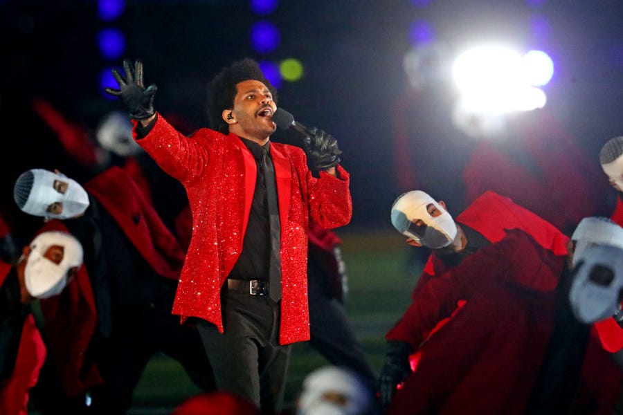 Feb 7, 2021; Tampa, FL, USA;  The Weeknd performs during the Super Bowl Halftime Show in Super Bowl LV at Raymond James Stadium.  Mandatory Credit: Mark J. Rebilas-USA TODAY Sports ORG XMIT: IMAGN-444308 ORIG FILE ID:  20210207_pjc_su5_733.JPG