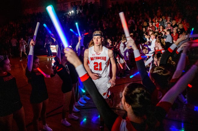 Metamora's Ethan Kizer takes the spotlight during player introductions before a game against Washington on Friday, Feb. 11, 2022 at Metamora Township High School. The Redbirds defeated the Panthers 50-45.
