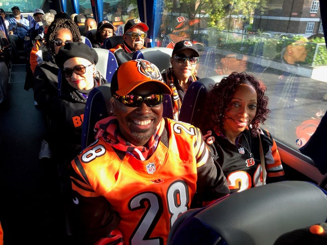 Enquirer Opinion Editor Kevin S. Aldridge and his wife Nichole (right) travel on a bus with a group of fans to Wembley Stadium in London, England to see the Bengals take on the Los Angeles Rams on Oct. 27, 2019. The group trip was organized by Karen Roseman-Harris, who has been arranging trips to Bengals away games for more than 35 years.
