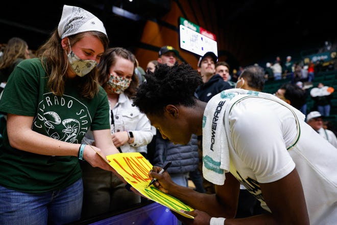 Colorado State Rams guard Kendle Moore (3) signs autographs after the game against the Fresno State Bulldogs at Moby Arena.