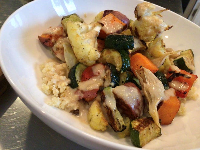Roasted vegetables with millet and Tahini dressing.