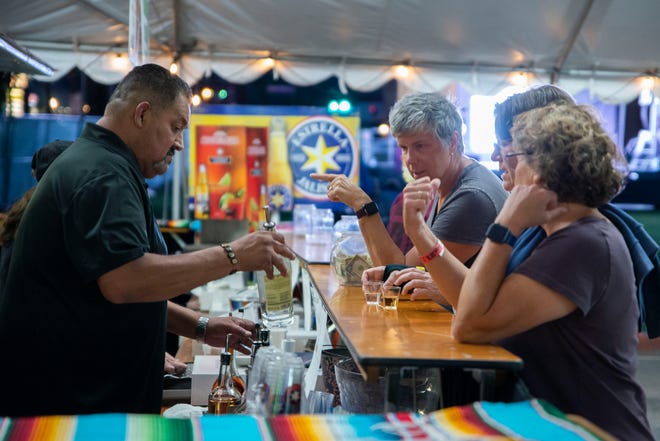 Patrons get deliberate over which tequila to try at Taste of Jalisco in Cathedral City on Feb. 11, 2022.