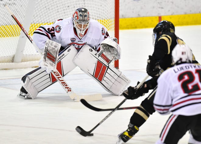 St. Cloud State goaltender David Hrenak concentrates on the puck during the first period of the game Friday, Feb. 11, 2022, at the Herb Brooks National Hockey Center in St. Cloud. 