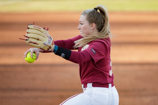 Florida State Seminoles pitcher Danielle Watson (31) winds up to pitch. The Florida State Seminoles defeated the Mercer Bears 12-0 at JoAnne Graf Field on Friday, Feb. 11, 2022.