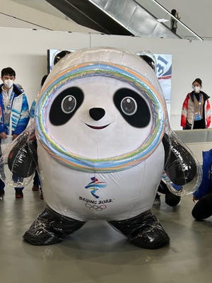 Winter Olympics mascot Bing Dwen Dwen poses for pictures with reporters in Beijing, China, on Feb. 12, 2022.