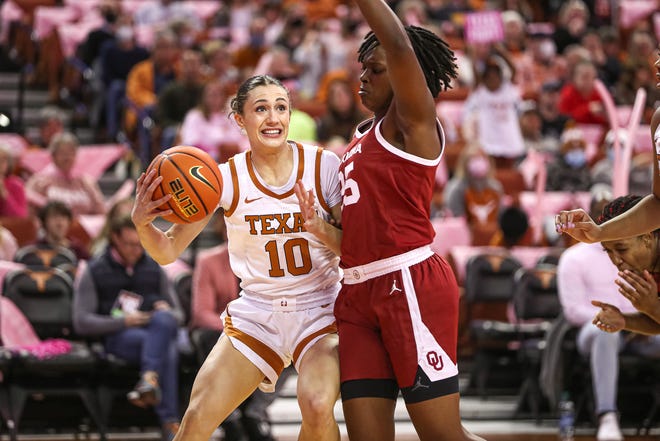 Texas guard Shay Holle protects the ball from the defense of Oklahoma guard Madi Williams during their game Feb. 12 at the Erwin Center. Holle, who starred at Westlake High School, originally signed with the Longhorns when Karen Aston was the head coach.