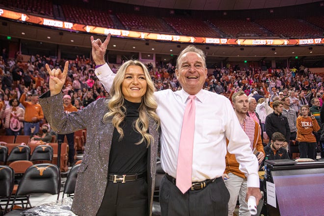 Texas head coach Vic Schaefer, right, and director of basketball operations Blair Schaefer, left, celebrate a win over Oklahoma at the Frank Erwin Center on Feb. 12, 2022. The Texas Longhorns defeated the Oklahoma Sooners 78-63.