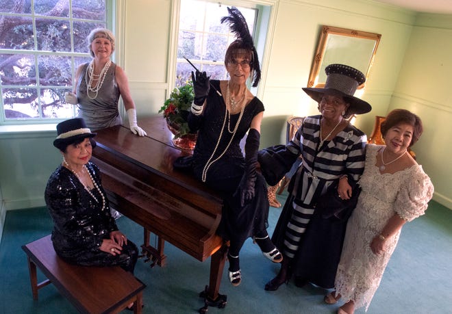 Starting clockwise at bottom left: Celina Fennell, Celia Gesting, Roz Love, Dorothy Drones and Susan Calvo, at the Abilene Woman's Club Foundation on Saturday to preview the group's Historical Fashion Show luncheon on Friday.