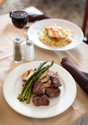 Steak tips with asparagus and potato wedges at Disch's Route 53 Tavern in Pembroke on Monday, Feb. 14, 2022.