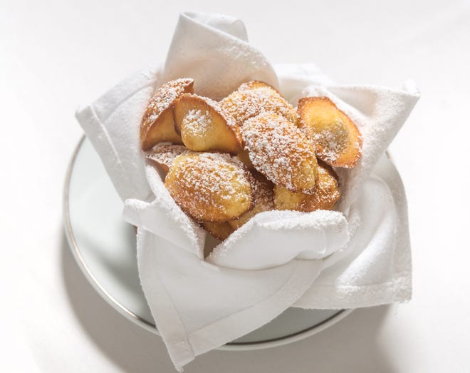 Madeleines are a complimentary offering after dinner at Cafe Boulud.