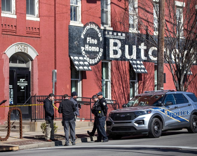 Police congregate at Butchertown Market, where Louisville Mayoral candidate Craig Greenberg was shot at in his law office.  Feb. 14, 2022